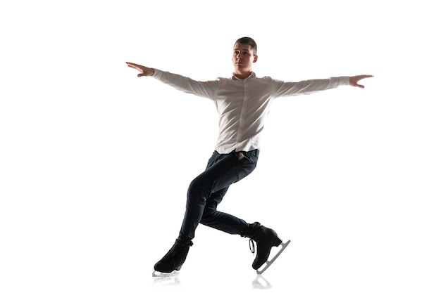 Man figure skating isolated. Professional practicing and training in action and motion on ice. Graceful and weightless. Concept of movement, sport, beauty.