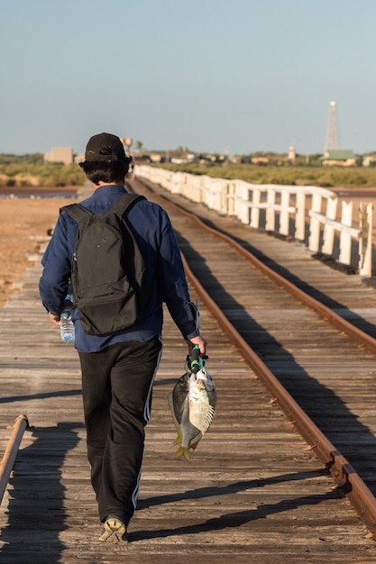 Man fishing on the jetty