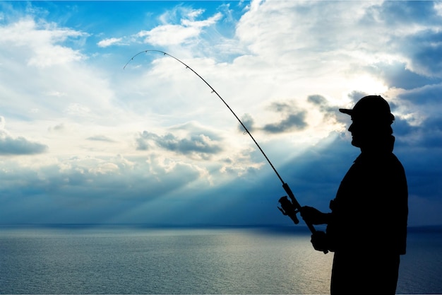 Man fishing on river on summer day