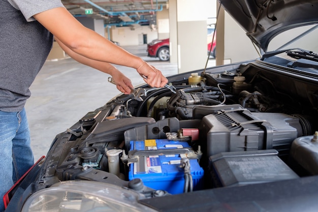 Man fix a car.