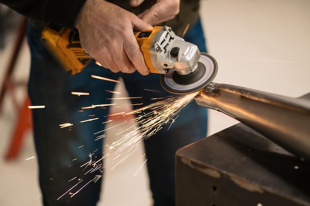 Man fixing a motorcycle in a modern workshop