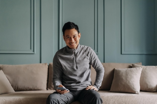 Man in fleece sitting in the living room in cold weather