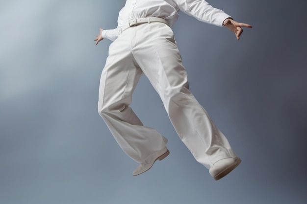 Man floating in the air wearing full white suit on a plain background
