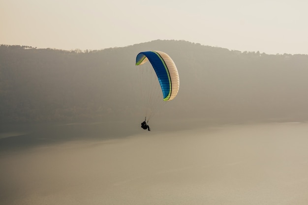 Man flying with paraglider.