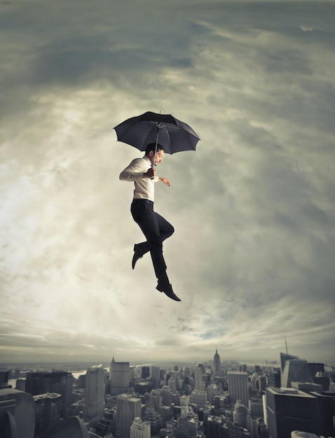 Man flying with an umbrella