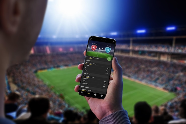 Photo man at a football match follows the odds and the current score the concept of online sports betting football stadium and crowd in the background