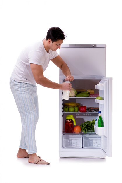 Man next to fridge full of food