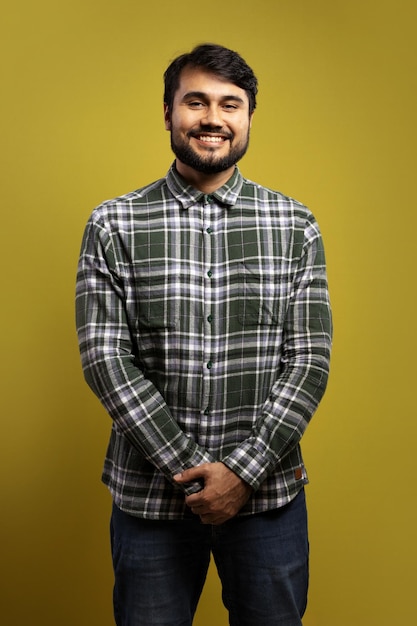 man from the front smiling holding his hands on his waist