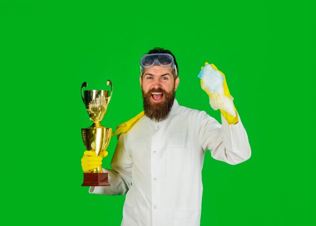 Man from professional cleaning service domestic work bearded man in uniform and gloves with cleanser