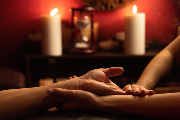 A man gets a relaxing hand massage in a spa salon