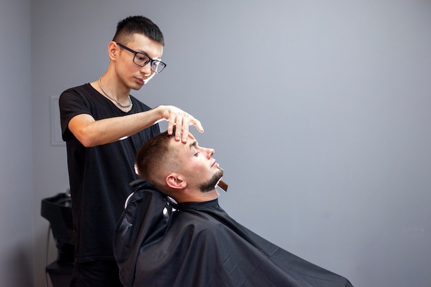 Man getting a haircut at the hairdresser