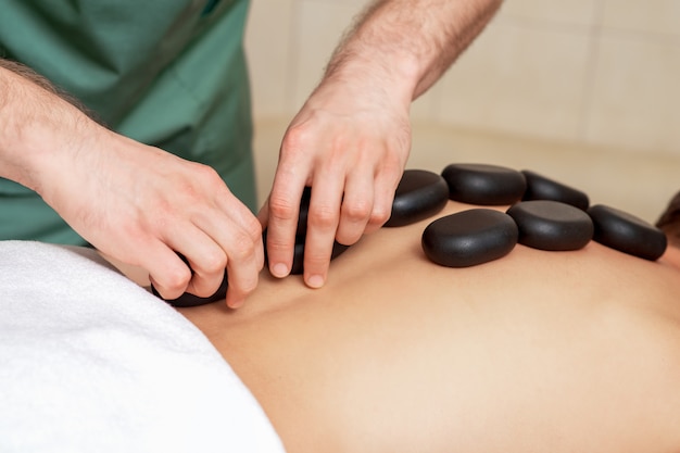 Man getting a hot stone massage.