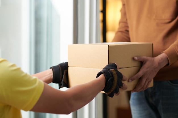 Man getting the parcel in box