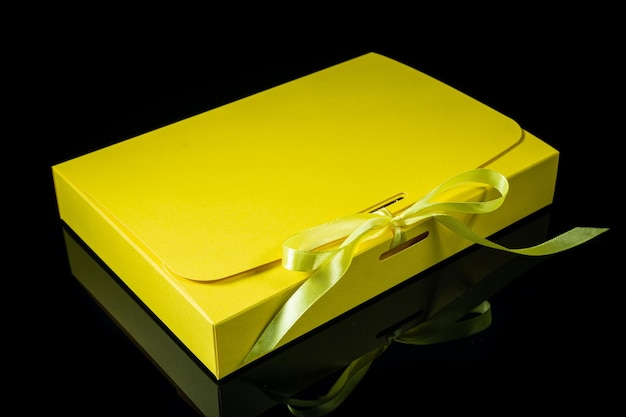 Man gift concept gift box with luxury bow on dark background Horizontal with copy space