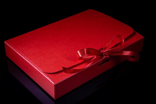 Man gift concept gift box with luxury bow on dark background Horizontal with copy space