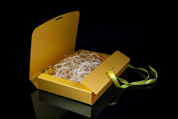 Man gift concept Open gift box with luxury bow on dark background Horizontal with copy space