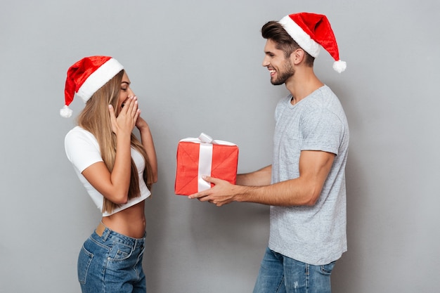 Man gives Christmas gift to his girlfriend