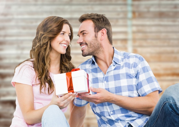 Man giving a gift to woman