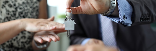 Man giving keys to new house owner