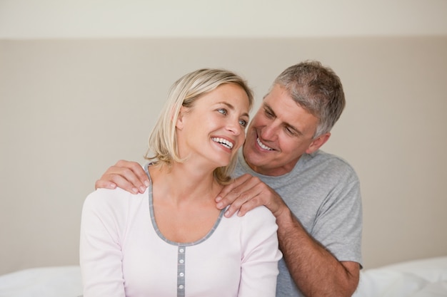 Man giving a massage to his wife