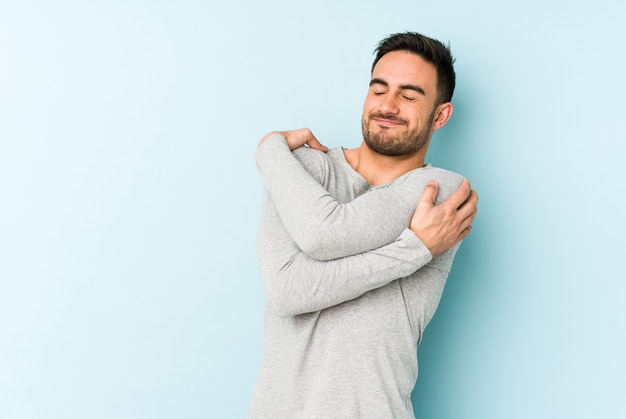 Man giving a self hug