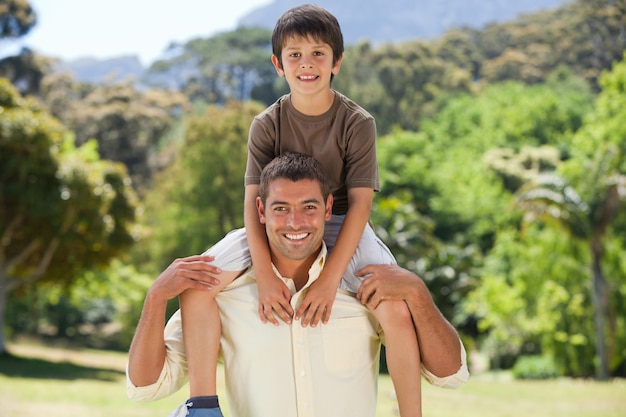 Man giving son a piggyback