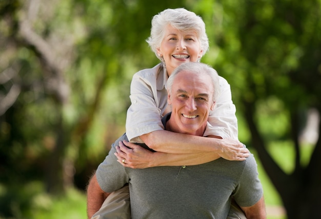 Man giving wife a piggyback