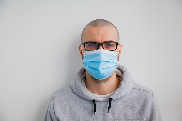 Man in glasses wearing protective mask