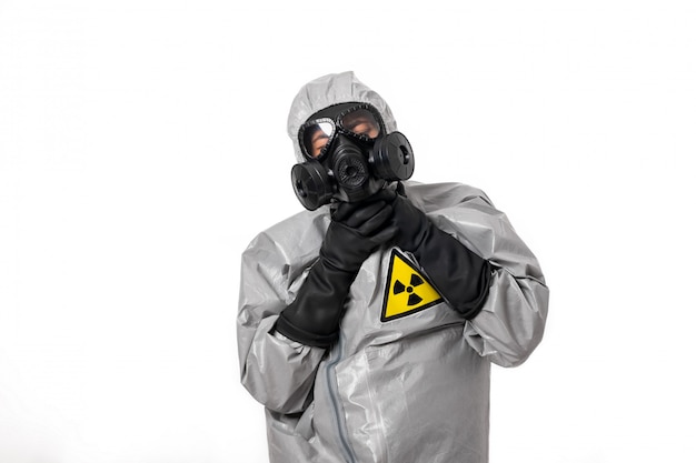 A man in a gray protective suit