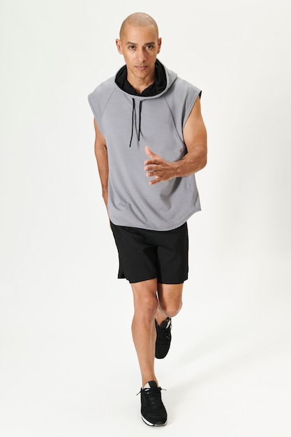 Man in a gray sleeveless hoodie