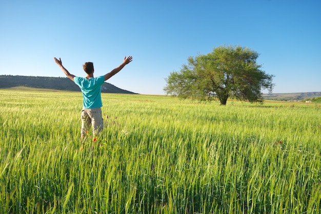 Man in green meadow