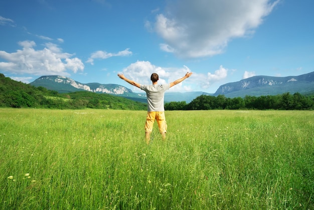 Man in green meadow