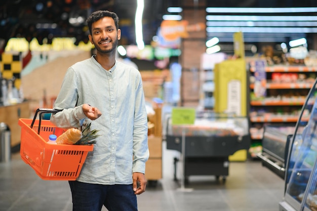 Man at grocery store products