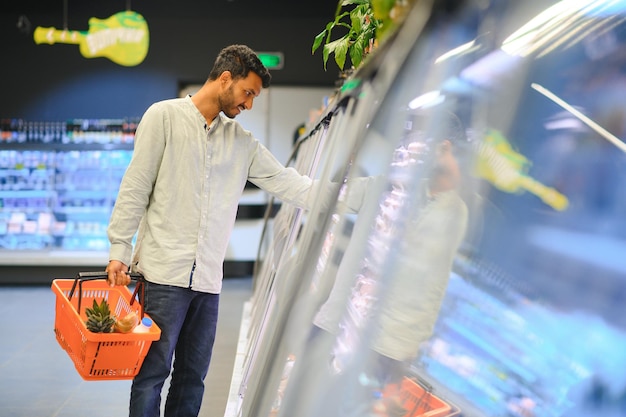 Man at grocery store products