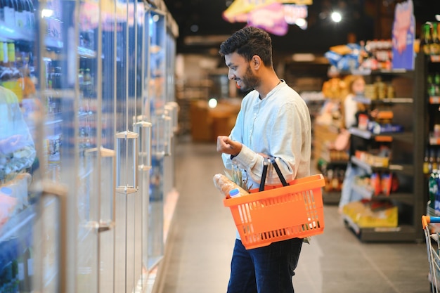 Man at grocery store products