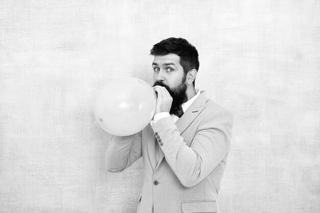 Man groom blue tuxedo bow tie hold air balloon wedding fun\
groom bearded hipster having fun with air balloon my happy day\
happy guy in cheerful mood fun and happiness concept lets have\
fun