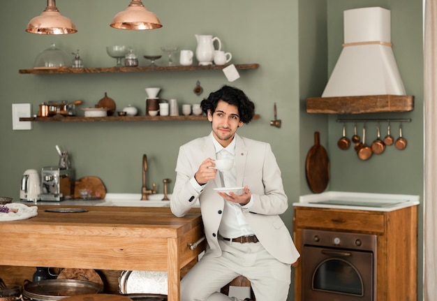 Man groom drinking coffee early in morning