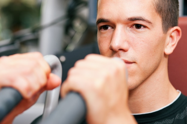 Man in gym exercising