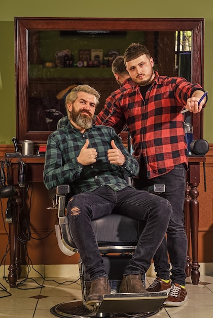 Man at hairdresser salon Barbershop client Barbershop services Perfect look Facial hair Handsome hipster Beard grooming Person sitting in hydraulic chair Visit hairdresser Maintaining shape