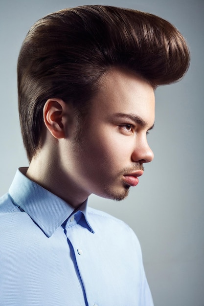 Man hairstyle fashion beauty on gry background