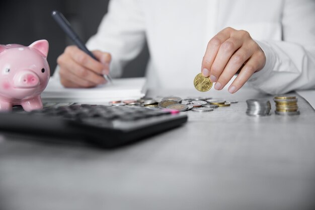 Man hand coins and calculator