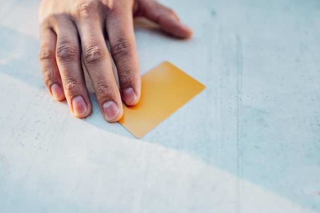 Man hand and a credit card on the table