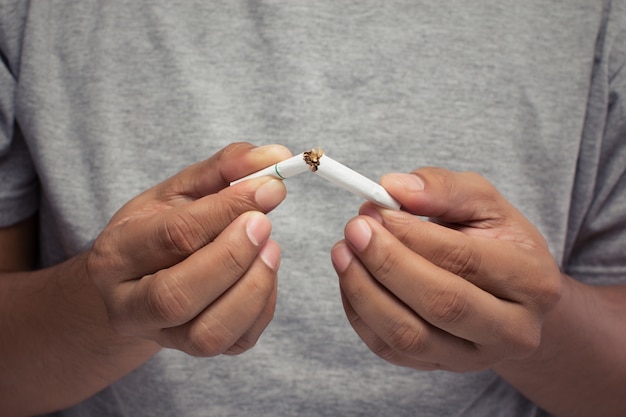 Man hand crushing cigarette