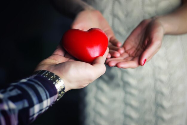 Man hand give valentine heart couple