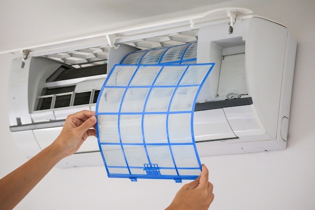 Man hand hold air conditioner filter cleaning concept