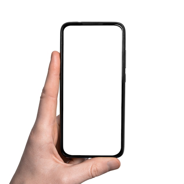 Man hand holding the black smartphone with blank screen isolated on white wall .