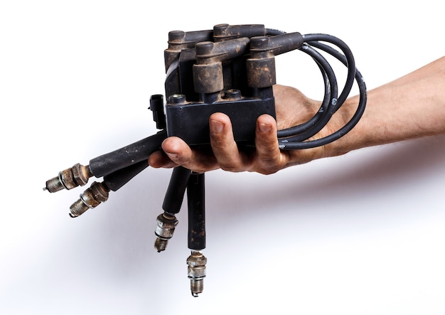 Man hand holding car ignition parts