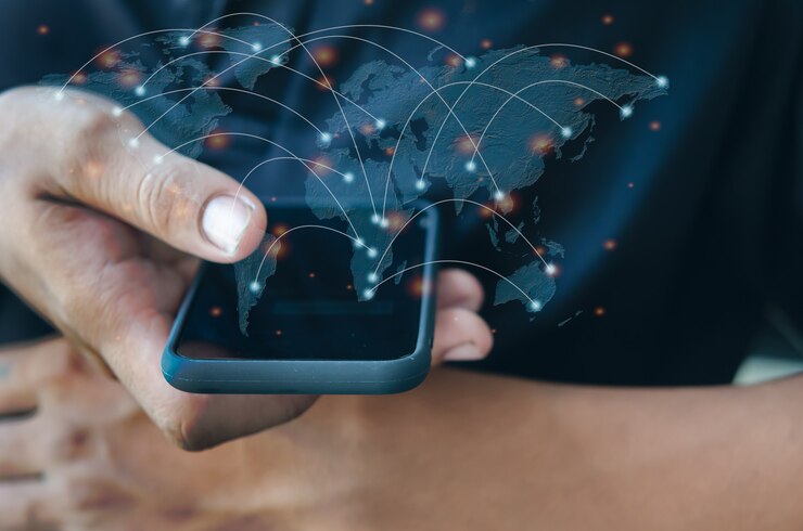Man hand holding a smartphone.Communicate with mobile phones and modern social networks around the world.Element of this image furnished by Nasa