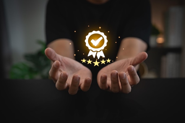 Man hand holding virtual icon providing a fivestar premium service hand man showing award high standards are guaranteed service quality the assurance five stars Guarantee the quality concept