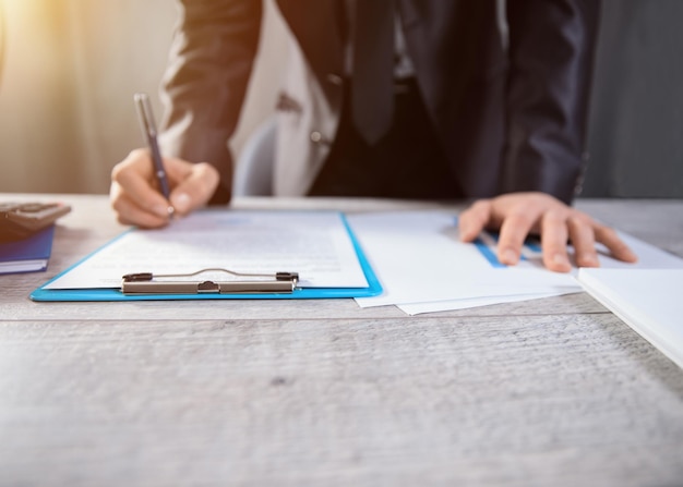 Man hand pen with document